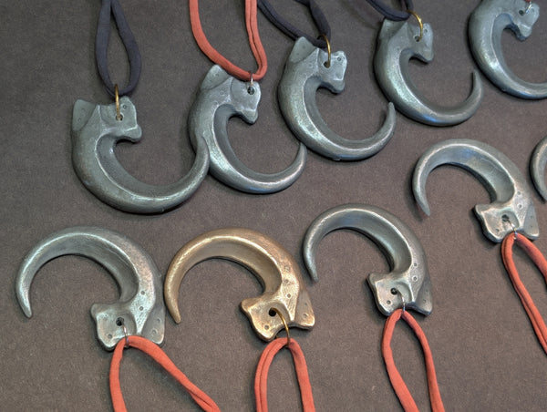 COLD CAST METAL CLAW PENDANT