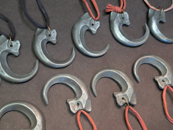 COLD CAST METAL CLAW PENDANT