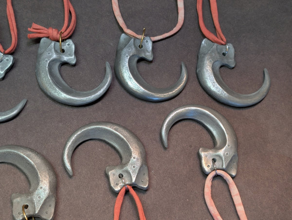 COLD CAST METAL CLAW PENDANT