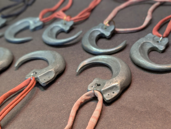 COLD CAST METAL CLAW PENDANT
