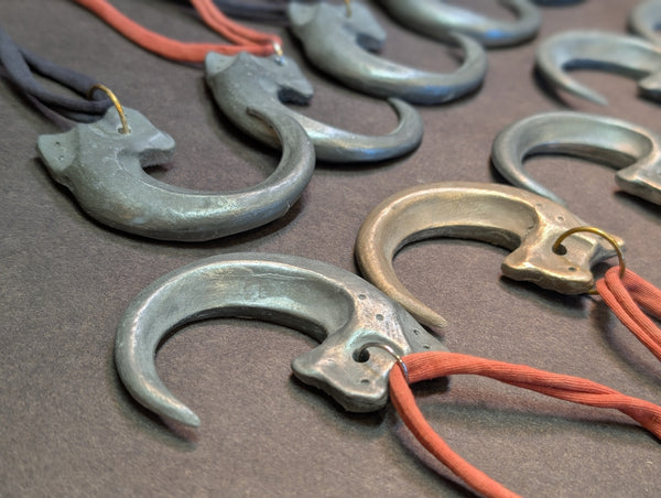 COLD CAST METAL CLAW PENDANT