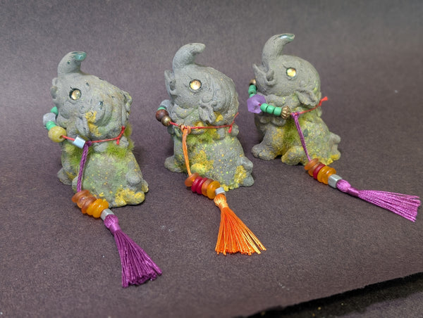 FAUX STONE BAKU FIGURINE