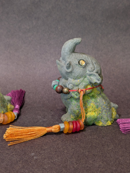 FAUX STONE BAKU FIGURINE