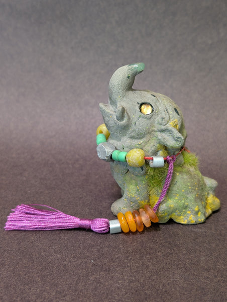 FAUX STONE BAKU FIGURINE