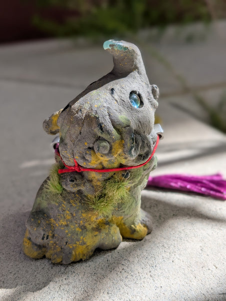 FAUX STONE BAKU FIGURINE