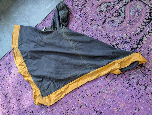 PONCHO/ CASE PURSE- NEOTROPOLIS DELIVERY OPTIONAL!