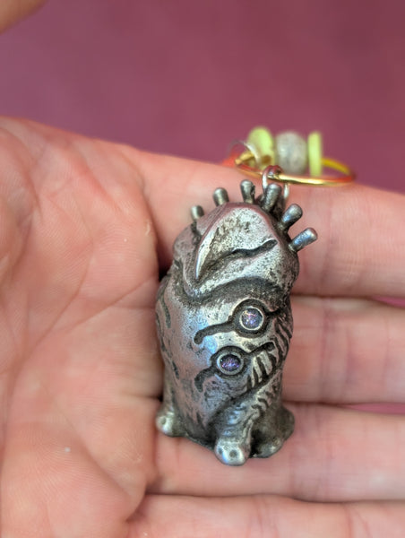 TOKEN OF **UNKNOWN PRONUNCIATION** ACOLYTE- PEWTER METAL- HANGING CHARM