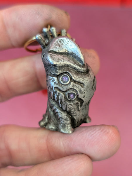 TOKEN OF **UNKNOWN PRONUNCIATION** ACOLYTE- PEWTER METAL- HANGING CHARM